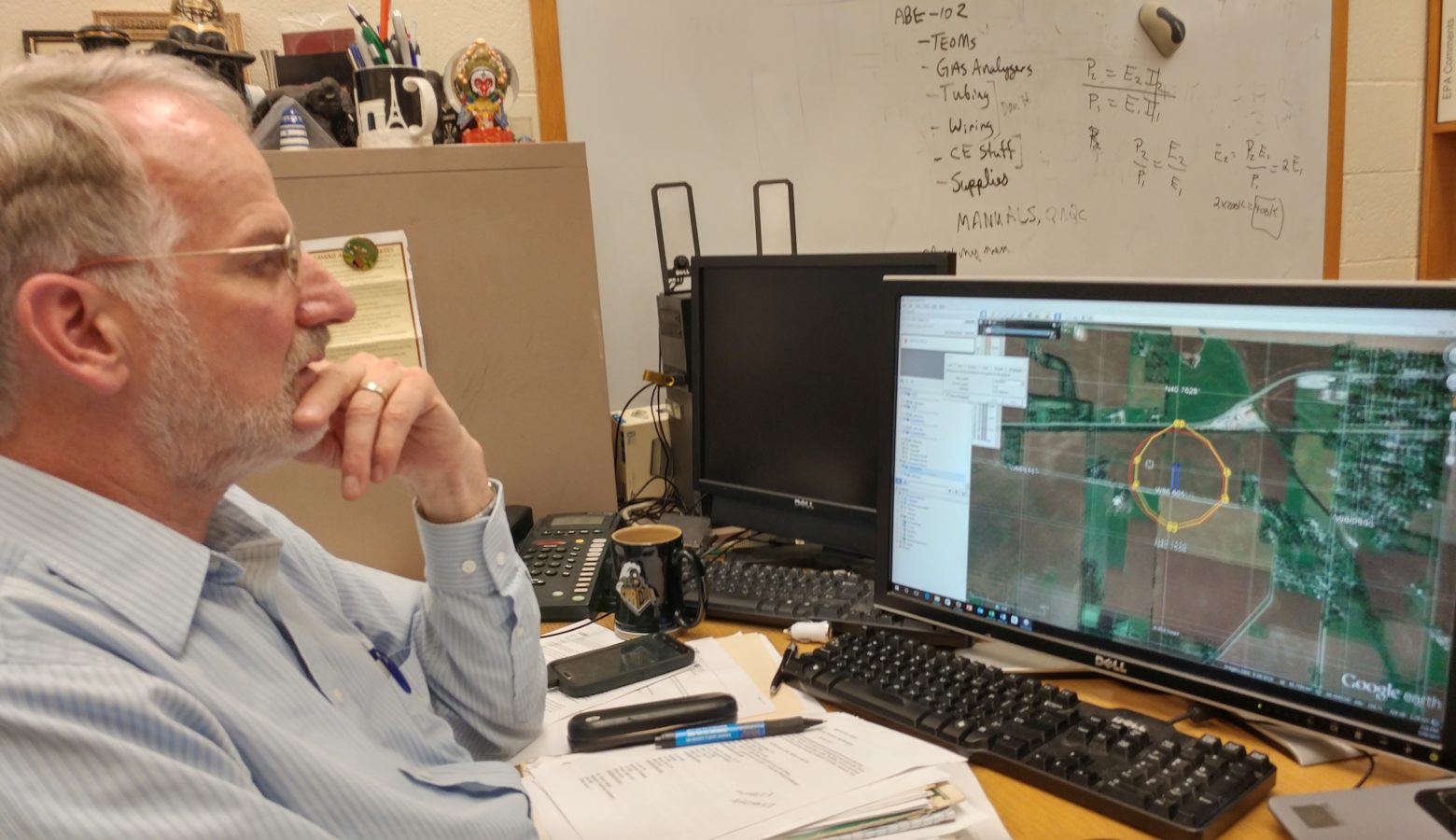 Purdue University agricultural engineer Al Heber plots a hypothetical CAFO setback using a computer model he created. (Annie Ropeik/IPB News)