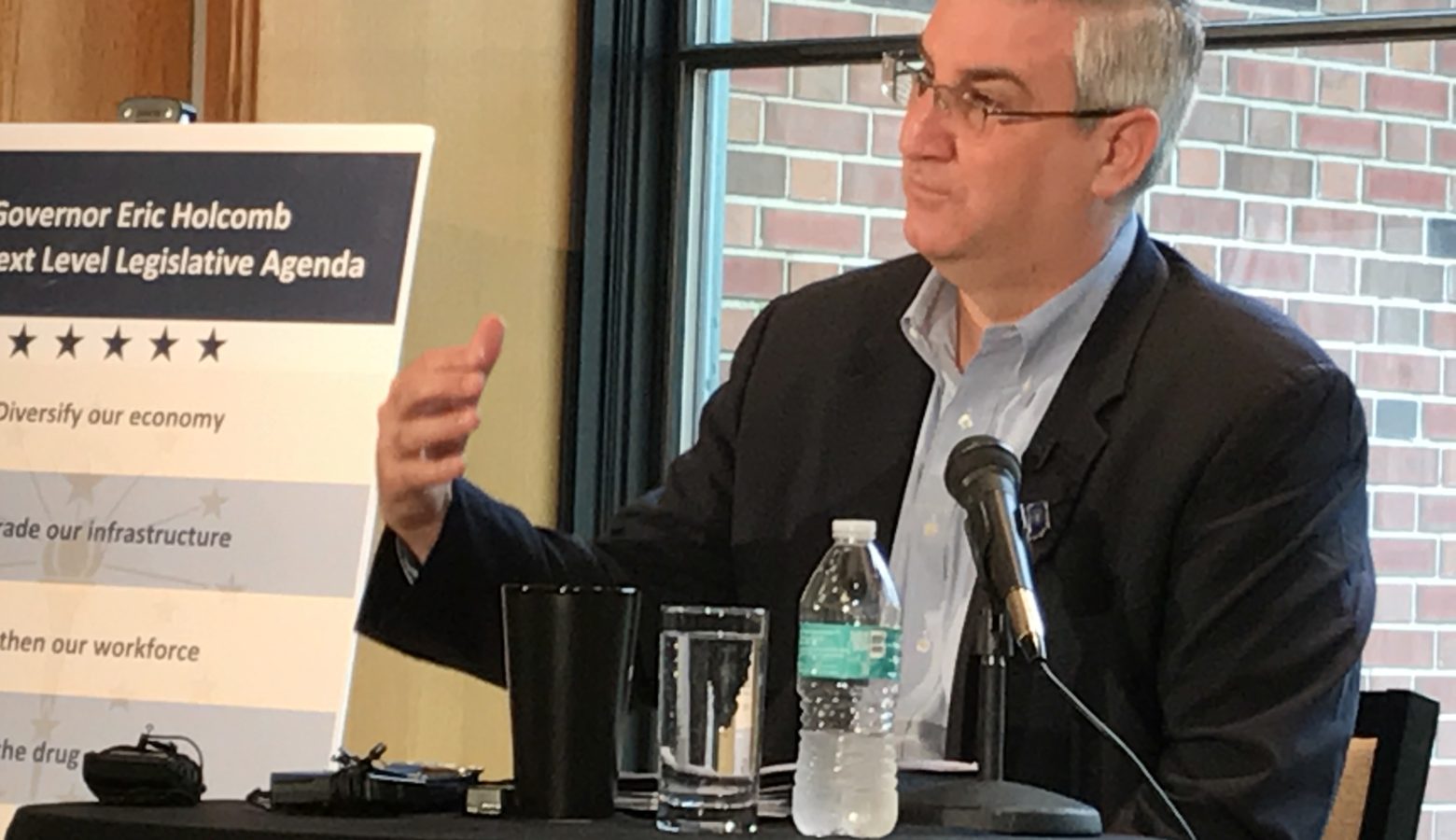 Gov. Eric Holcomb discusses provisions of road funding legislation while speaking with reporters at his residence. (Brandon Smith/IPB News)