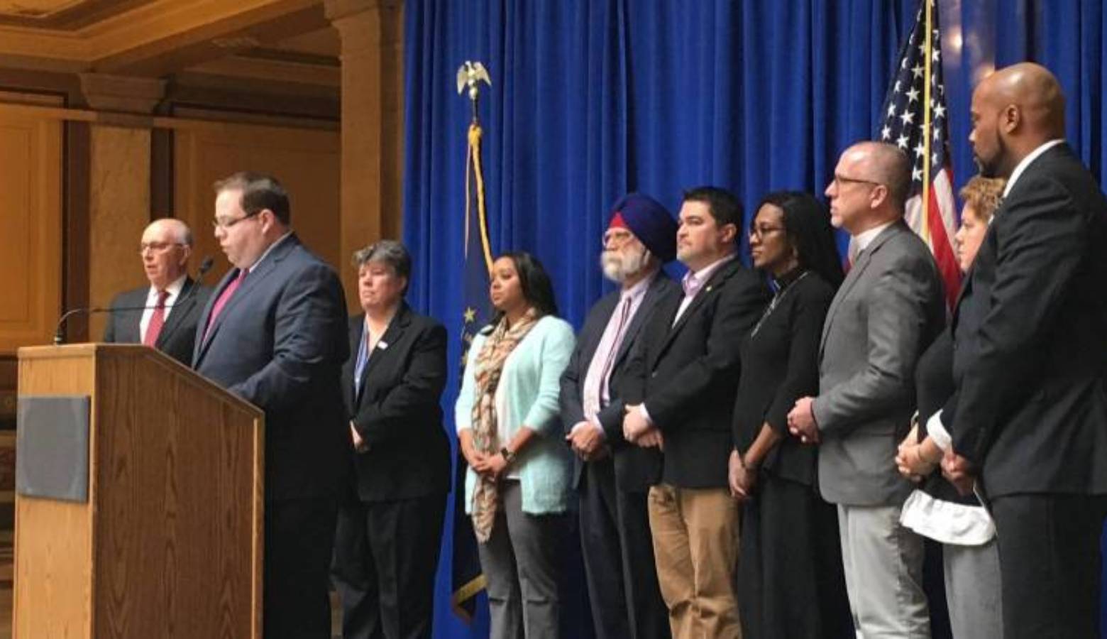 Flanked by a group of faith and community leaders, David Sklar of the Jewish Community Relations Council spoke Wednesday, March 15, 2017 at the Indiana Statehouse.
