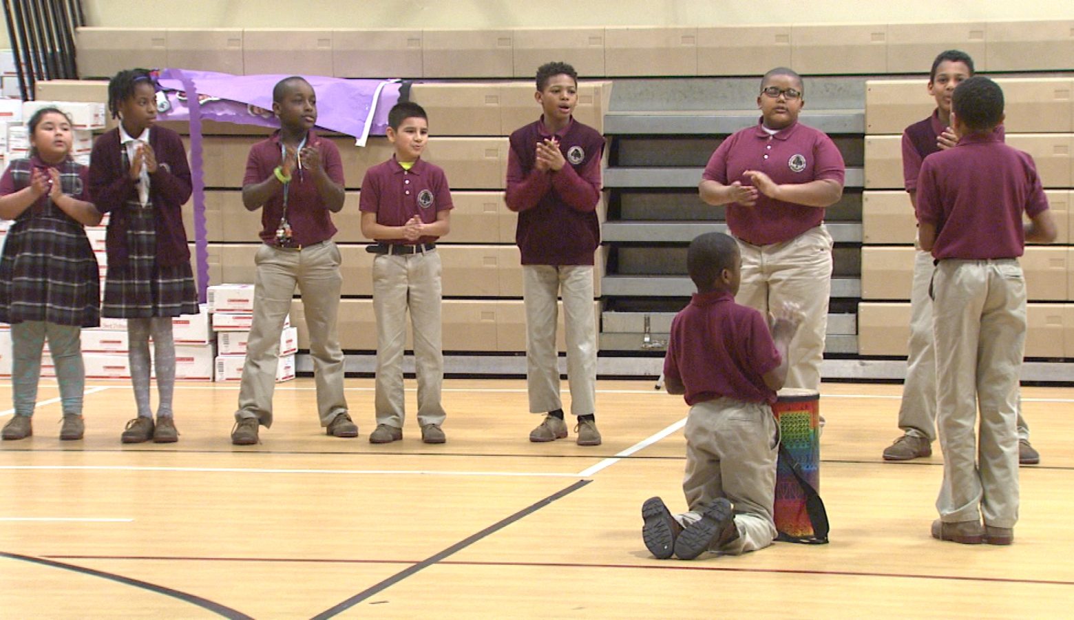 Students at Tindley Genesis Academy in Indianapolis participate in the morning meeting, which blends songs, chants and dancing. Music is at the center of all curriculum at the school. (Steve Burns/WTIU)