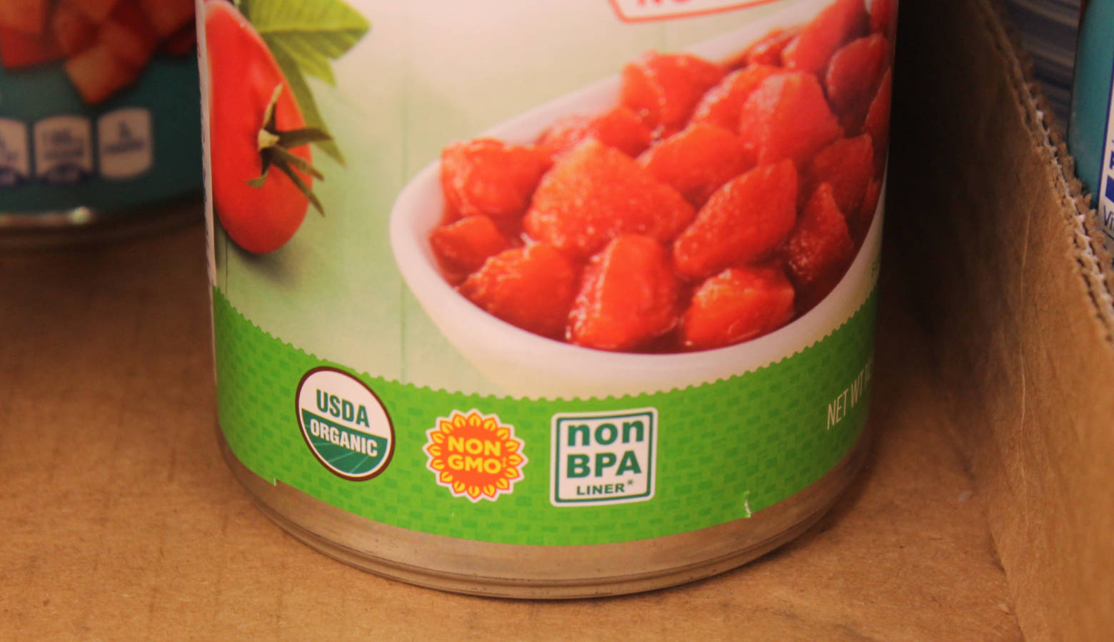 A can of store-brand diced tomatoes includes three different food labels. A new study from Purdue seeks to examine how labels and certification can affect prices and consumer choice. (Lauren Chapman/IPB News)