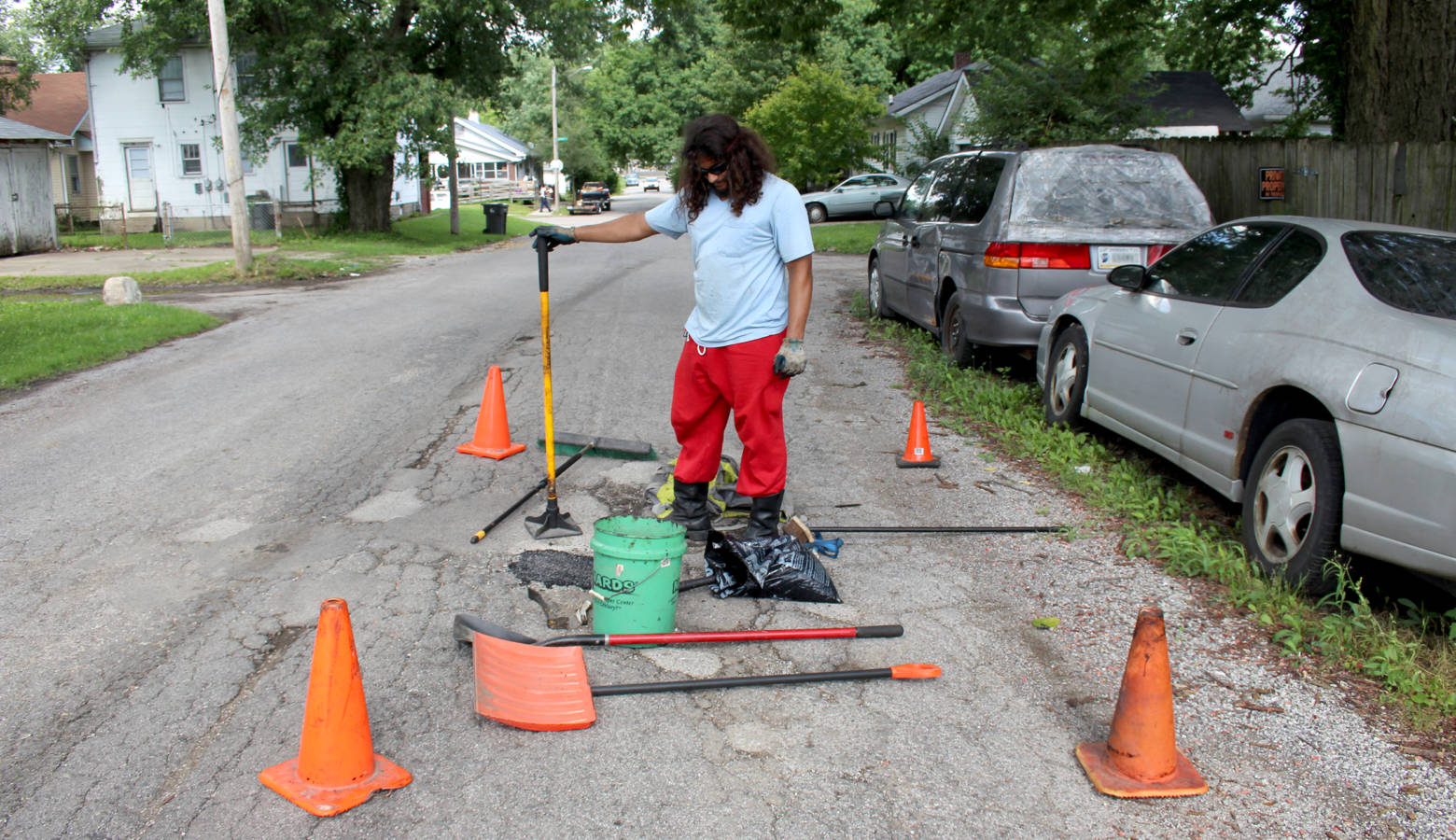 Michael Warren has spent about $400 out-of-pocket this summer to fill potholes in his Indianapolis neighborhood. (Annie Ropeik/IPB News)