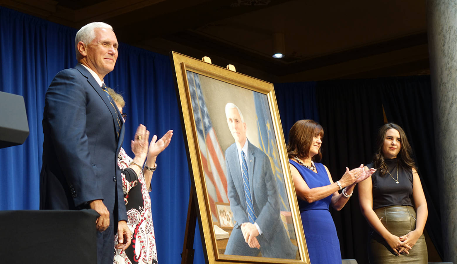 Vice President Mike Pence, his mother, wife Karen, and youngest daughter unveil his gubernatorial portrait. (Lauren Chapman/IPB News)
