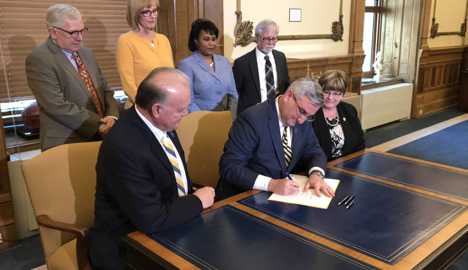 Gov. Eric Holcomb signs legislation to mandate all state lawmakers undergo sexual harassment training each year. (Brandon Smith/IPB News)