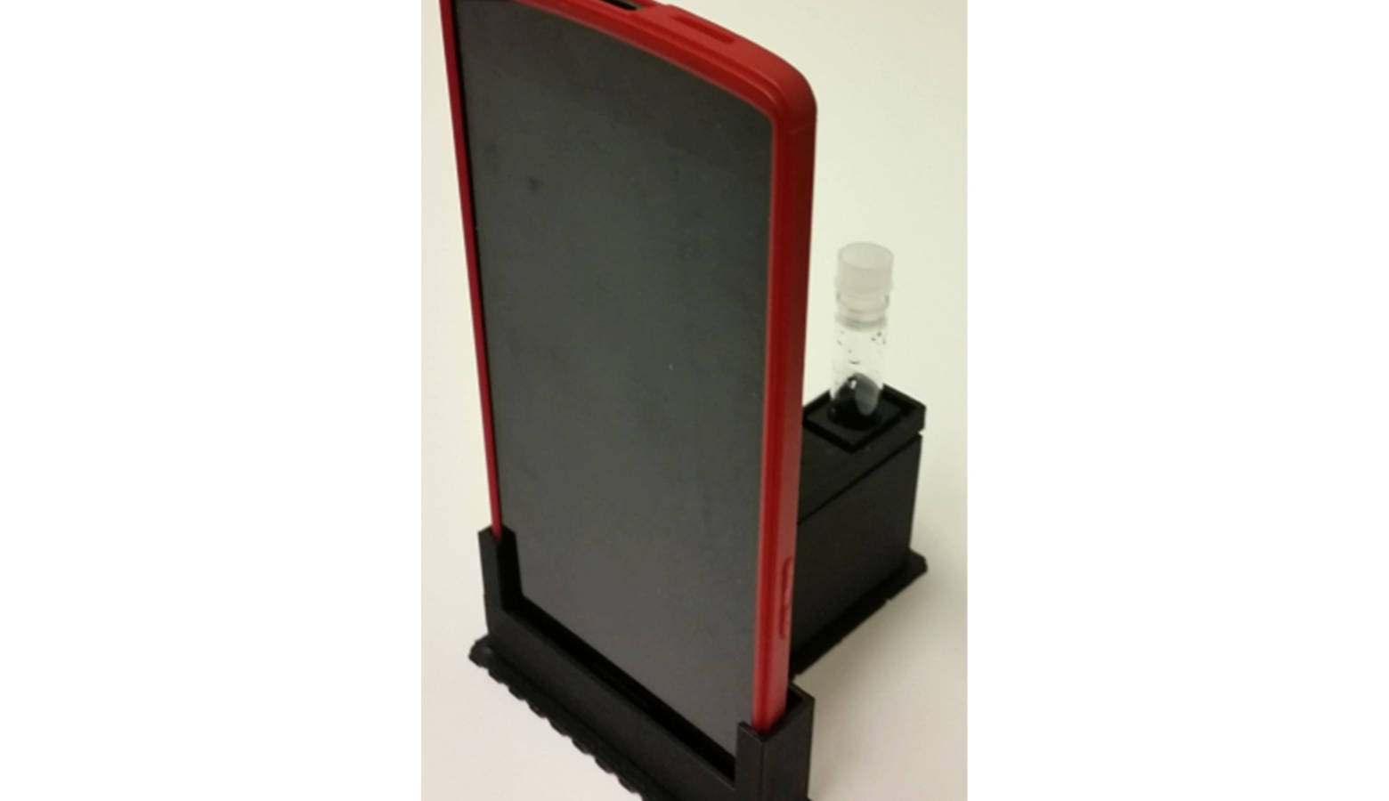 The cradle uses the phone's camera to detect low light from E. coli. (Photo courtesy of Purdue University)