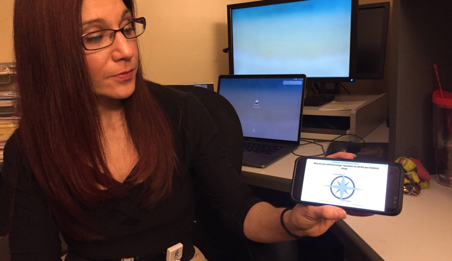 Indiana University School researcher Dawn Neumann demonstrates the My Emotional Compass app. (Jill Sheridan/IPB News)