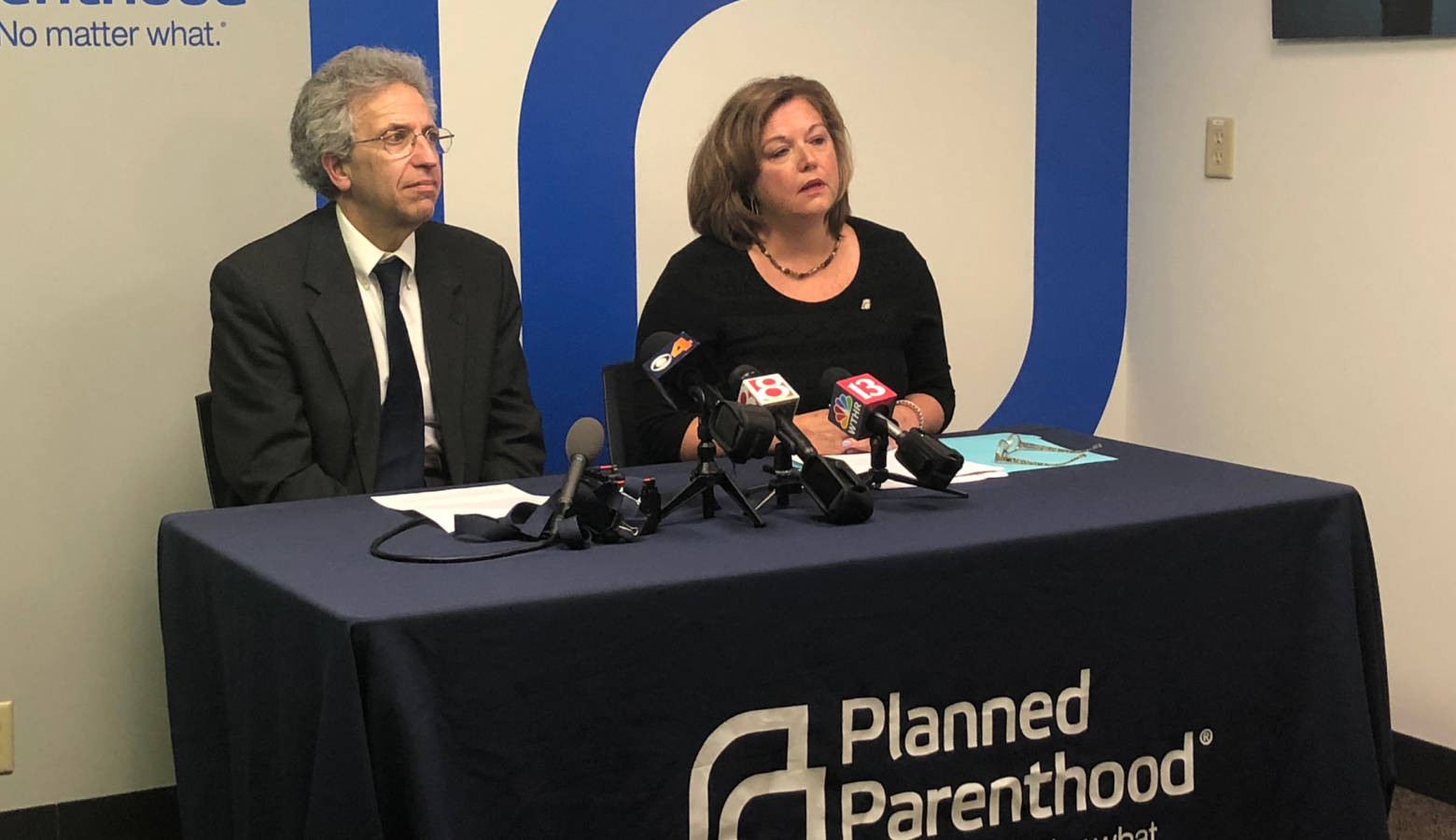 ACLU of Indiana Legal Director Ken Falk (left) and Planned Parenthood of Indiana and Kentucky CEO Christie Gillespie (right) discuss a federal judge halting Indiana's abortion reporting law. (Sarah Panfil/WFYI)