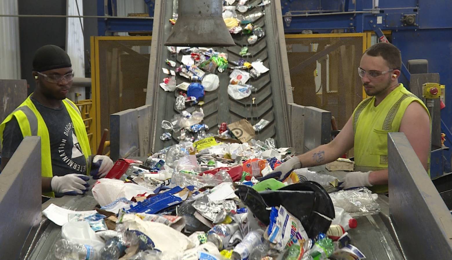 Workers sort recycling at Rumpke's material recovery facility in Cincinnati, Ohio (Zach Herndon/Indiana Public Media)