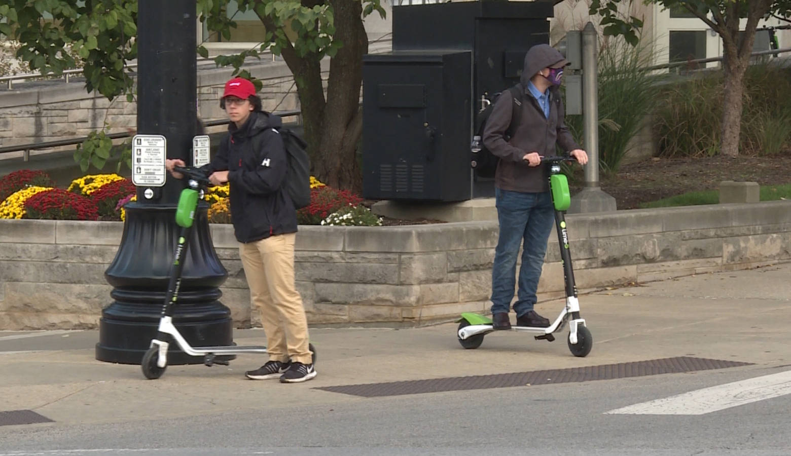 Students catch rides on Lime scooters at Indiana University (Zach Herndon/WTIU)