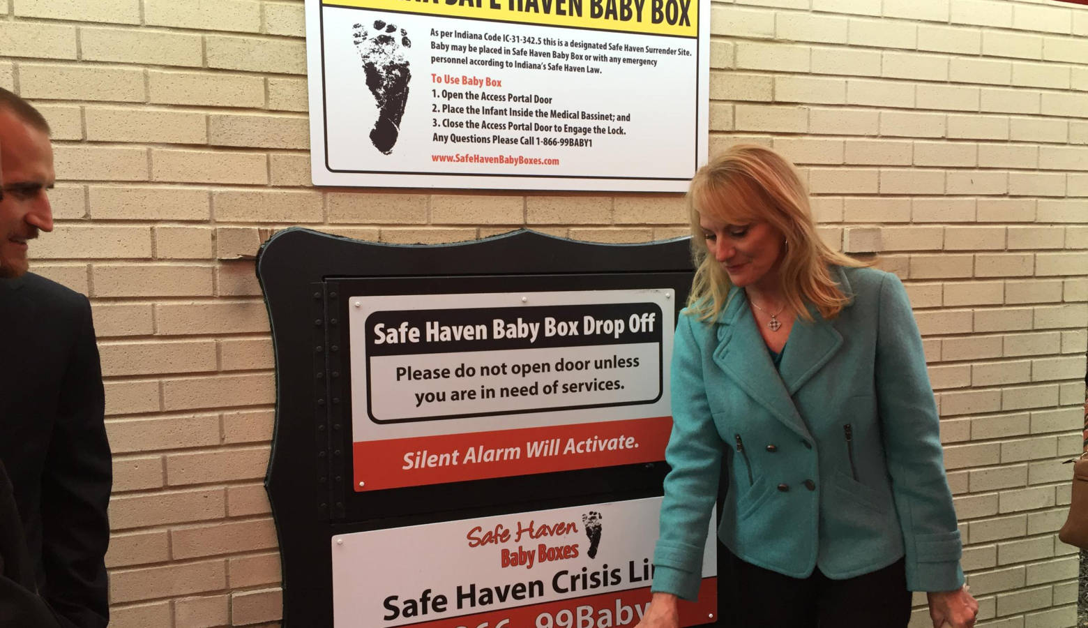 Linda Znachko, founder of He Knows Your Name Ministry, stands by the new baby box in Carmel. (Jill Sheridan/IPB News)