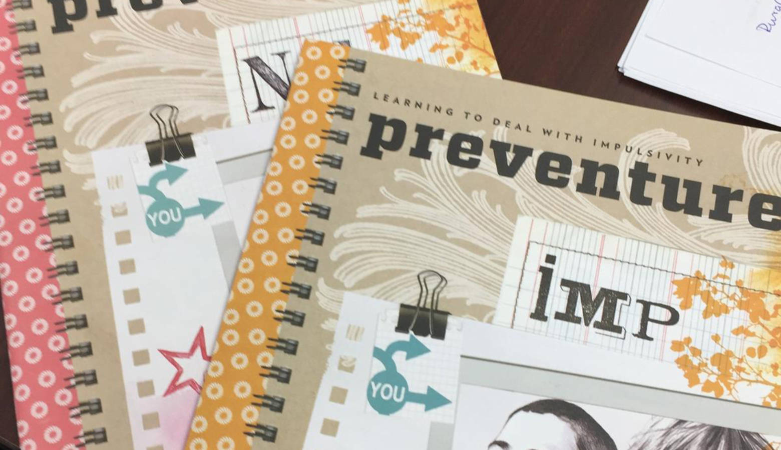 The workbooks used through the Preventure program. (Jill Sheridan/IPB News)