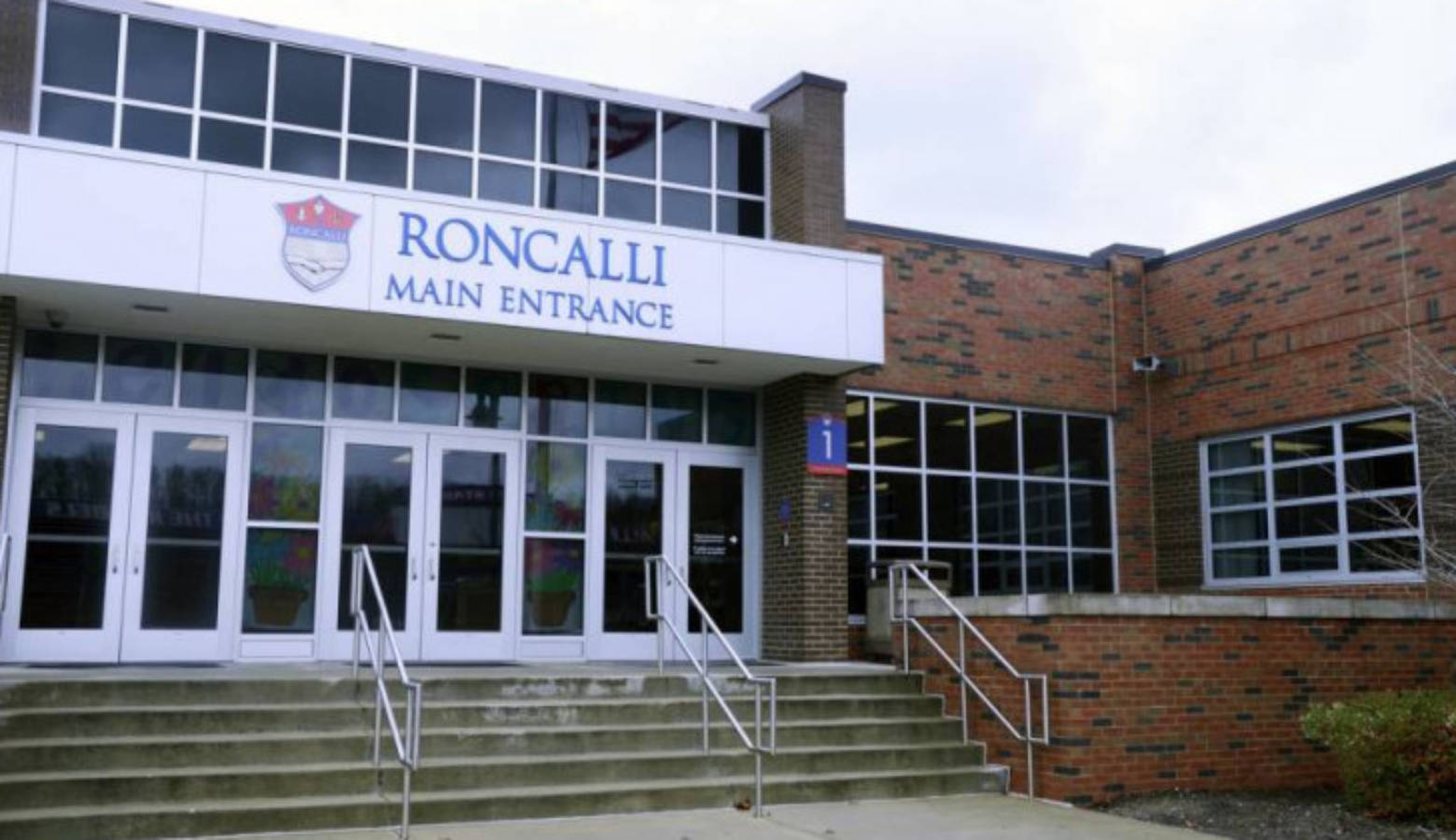 Shelly Fitzgerald, a Roncalli High School guidance counselor placed on paid administrative leave after her marriage to a woman became public, has filed a discrimination claim against the school and the Archdiocese of Indianapolis.