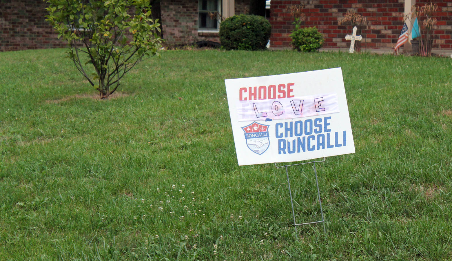 A sign from a house close to Roncalli High School protests the treatment of a guidance counselor. Shelly Fitzgerald's job has been threatened by the school over her marriage to a woman. (Lauren Chapman/IPB News)