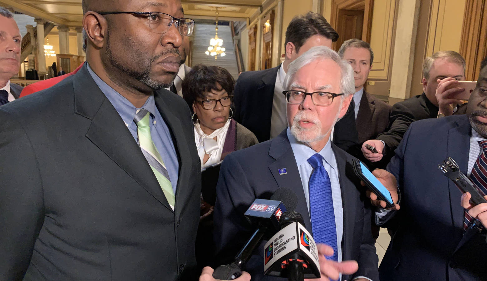 Sen. Greg Taylor (D-Indianapolis) and Sen. Tim Lanane (D-Anderson) discuss a change made to the hate crimes bill. (Brandon Smith/IPB News)