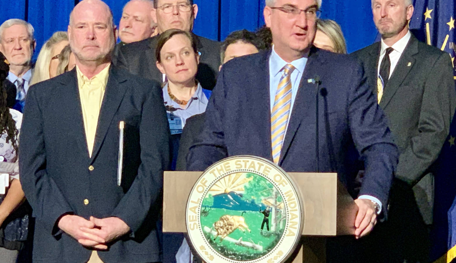 Gov. Eric Holcomb surrounded by Republican legislative leaders and state agency officials. (Brandon Smith/IPB News)