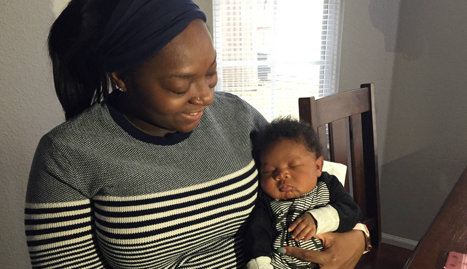 Zuri Davidson with baby Hendricks at their home in Indianapolis. (Jill Sheridan/IPB News)