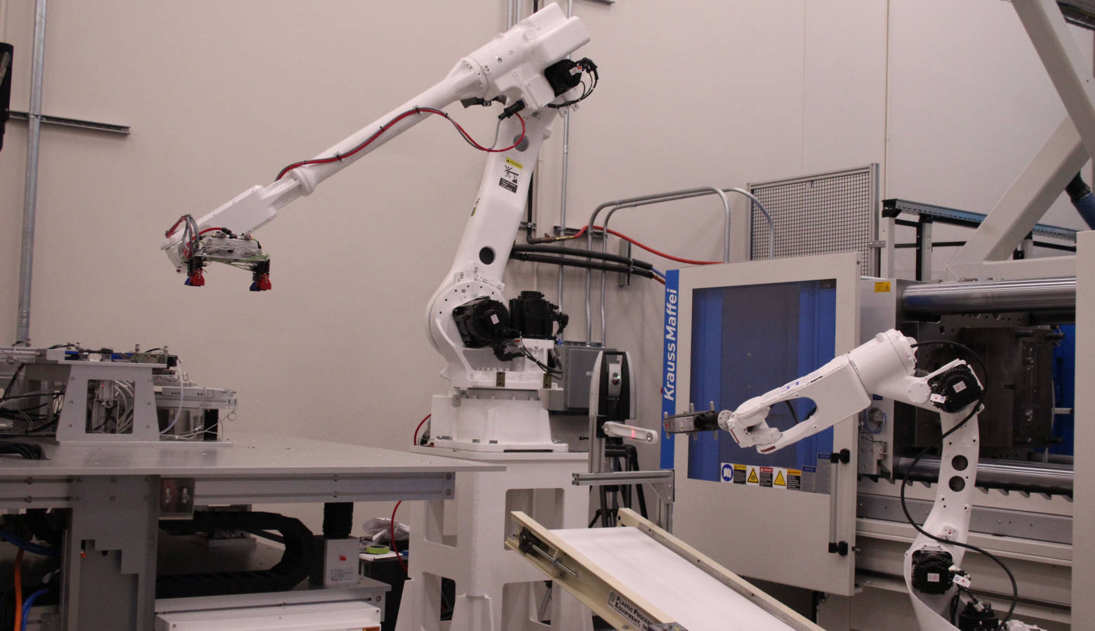 Inside Purdue University's new Manufacturing Design Laboratory, robots fabricate pieces, then hand them off to one another for testing – all without humans touching the parts. (Samantha Horton/IPB News)