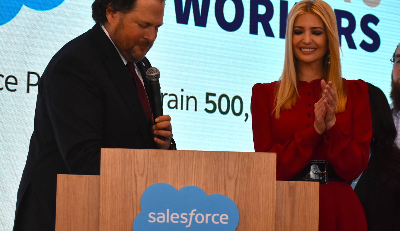 Salesforce Chairman Marc Benioff signs President Trump's "Pledge to America's Workers" alongside Ivanka Trump. (Justin Hicks/IPB News)