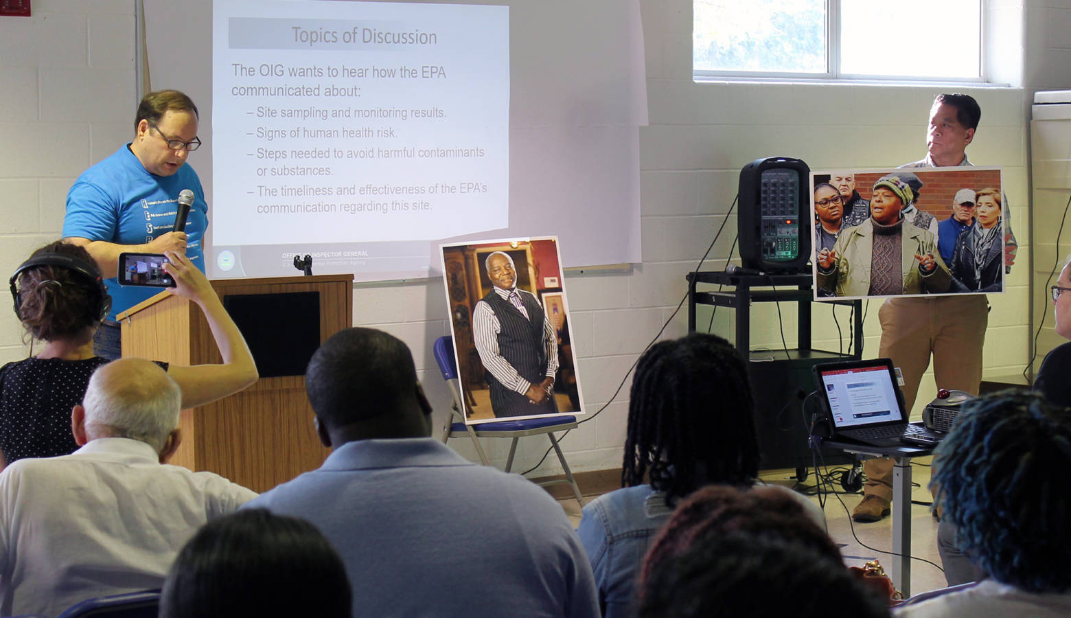 East Chicago resident and activist Larry Davis makes his comments to the OIG with photos of Duke Florence and Sherlene Lowe – two residents and vocal activists who died recently of similar cancers. (Lauren Chapman/IPB News)