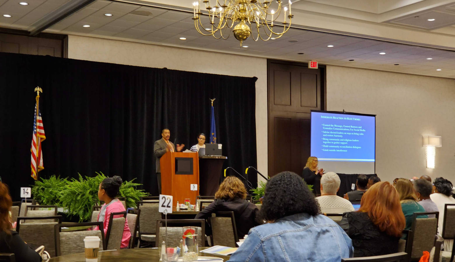 Department of Justice specialist Ken Bergeron and Women4Change Indiana executive director Rima Shahid address an Indiana Civil Rights Commission Conference. (Samantha Horton/IPB News)