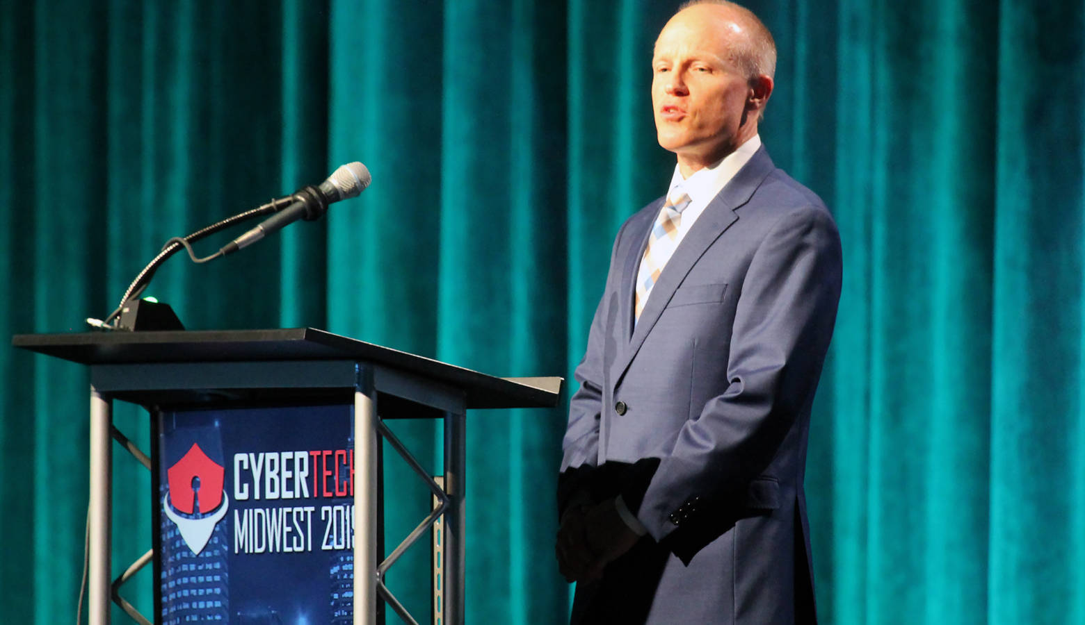 Rolls-Royce president of defense programs, Phil Burkholder, announces a new partnership with Purdue University to improve cybersecurity training at the Cybertech Midwest conference in Indianapolis. (Lauren Chapman/IPB News)