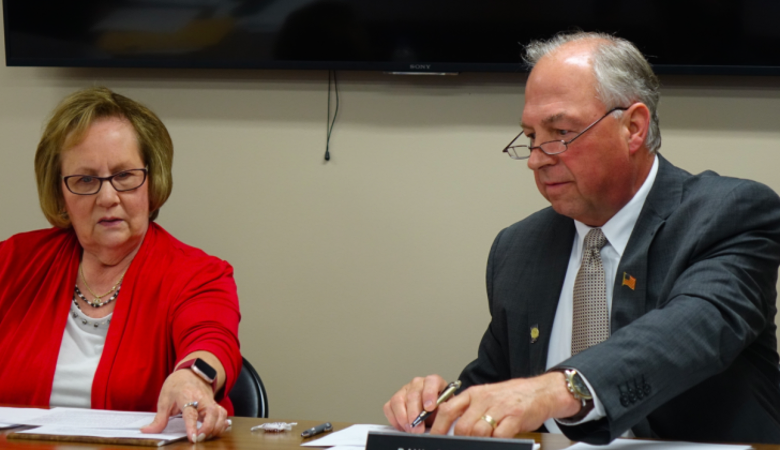 Daleville Community School's Board President Diane Evans, left, and Superintendent Paul Garrison look at documents before the school board votes to close Indiana Virtual School and Indiana Virtual Pathways Academy during a board meeting Monday, Aug. 26, 2019 at the district office.