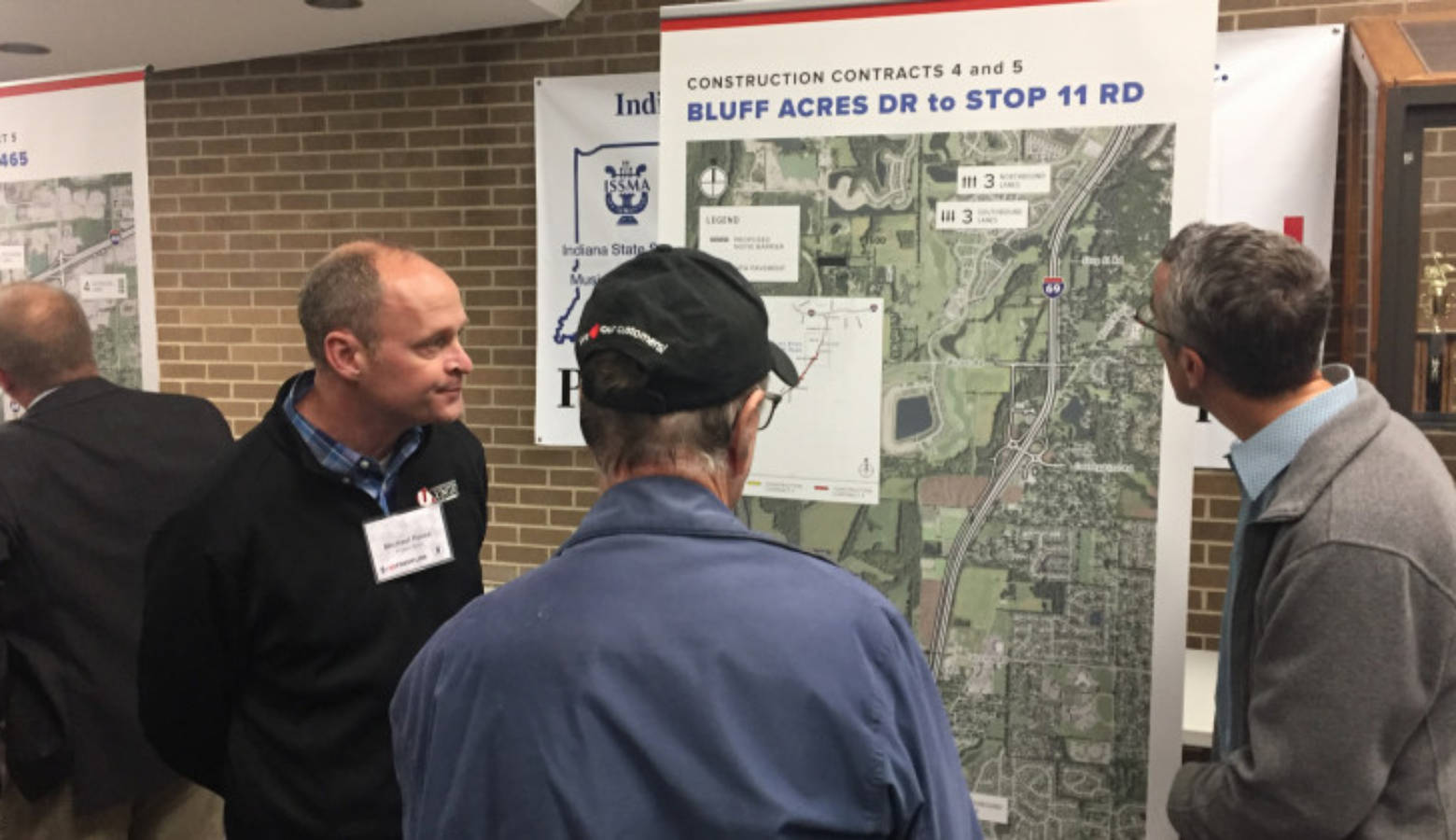 Local residents examine a map explaining changes part of the I-69 Section 6 project.