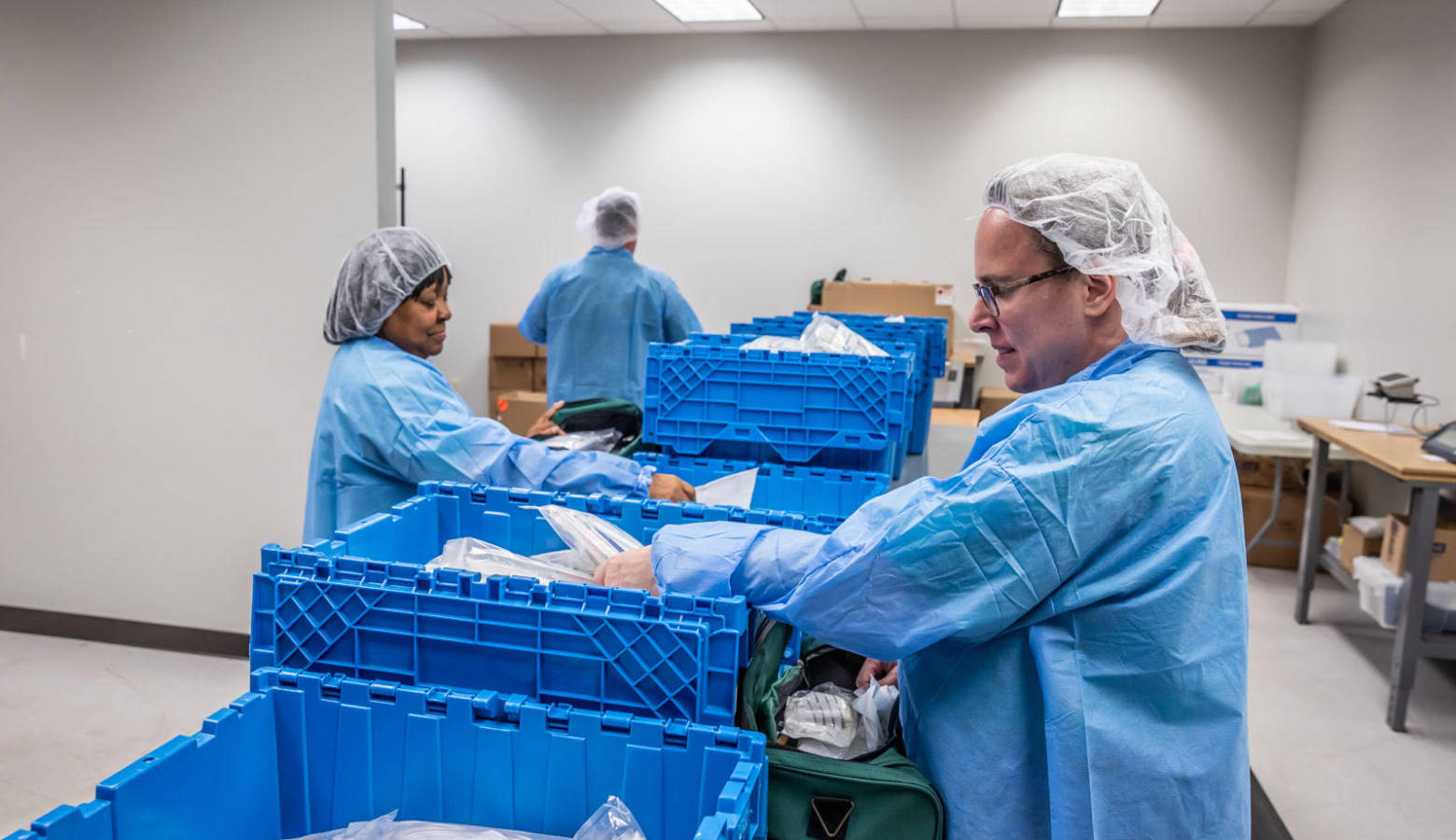 Workers at Bosma Enterprises with visual impairments packaging products. (Courtesy of Bosma Enterprises)