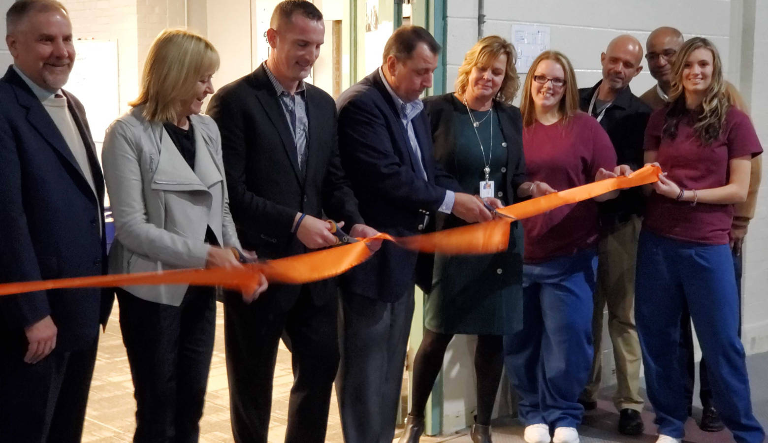 Indiana Department of Corrections and Televerde officials cut a ribbon to celebrate the opening of a new call center at Madison Correctional Facility. (Samantha Horton/IPB News)