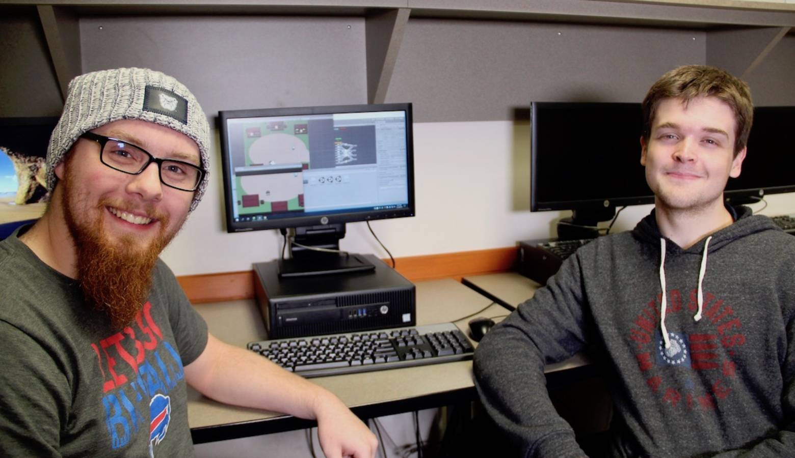 Butler University students Mathew O'Hern, left, and Parker Winters, right, are developing a video game to assist children with autism improve social skills. (Provided by Butler University)