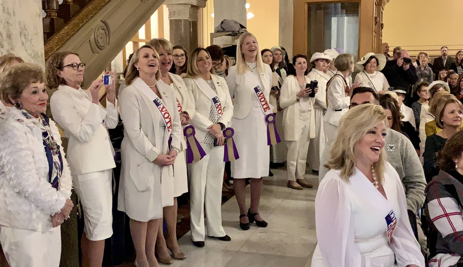 Members of the Indiana General Assembly celebrate the women's suffrage centennial at the Statehouse. (Brandon Smith/IPB News)