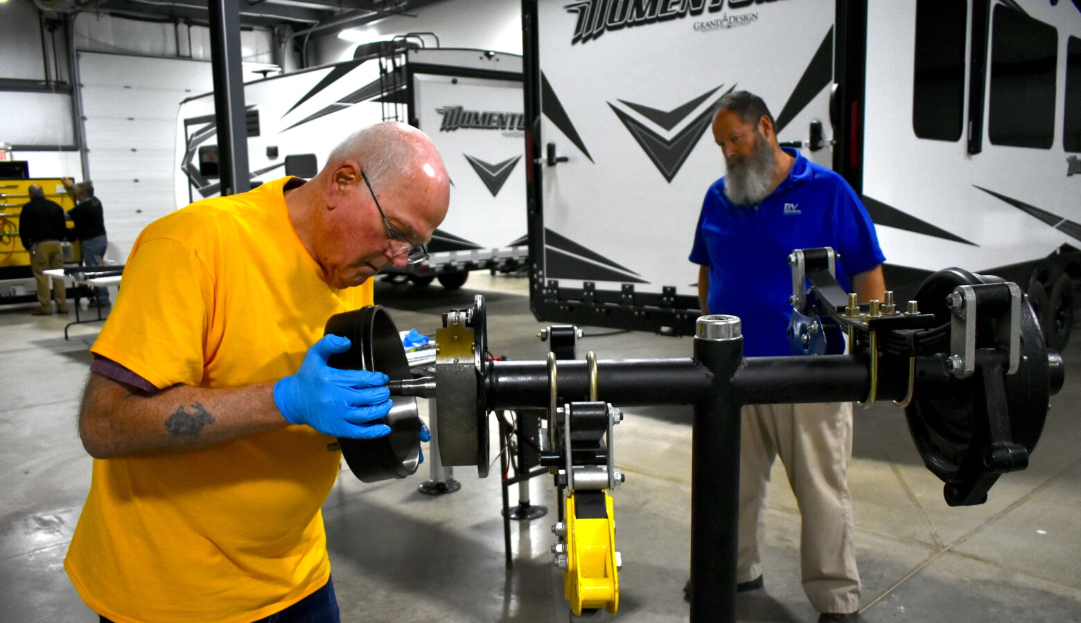 Ralph Decker completes his last practical exam under the supervision of instructor Mike Curl at the RV Technical Institute. (Justin Hicks/IPB News)