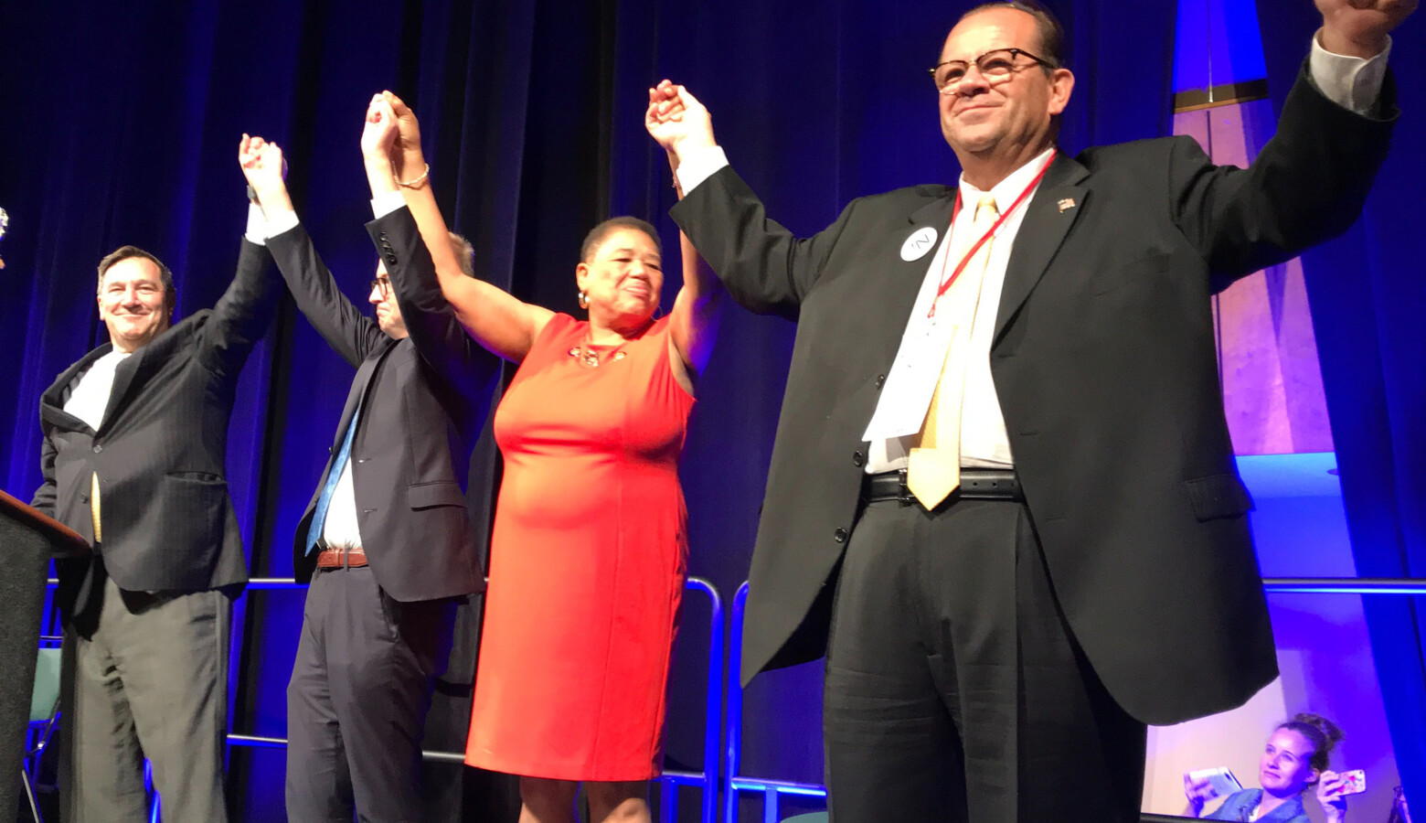 A state party convention staple that will be missing this year: in 2018, Indiana Democrats' statewide candidates joined hands on stage as the convention wrapped up. (FILE PHOTO: Brandon Smith/IPB News)