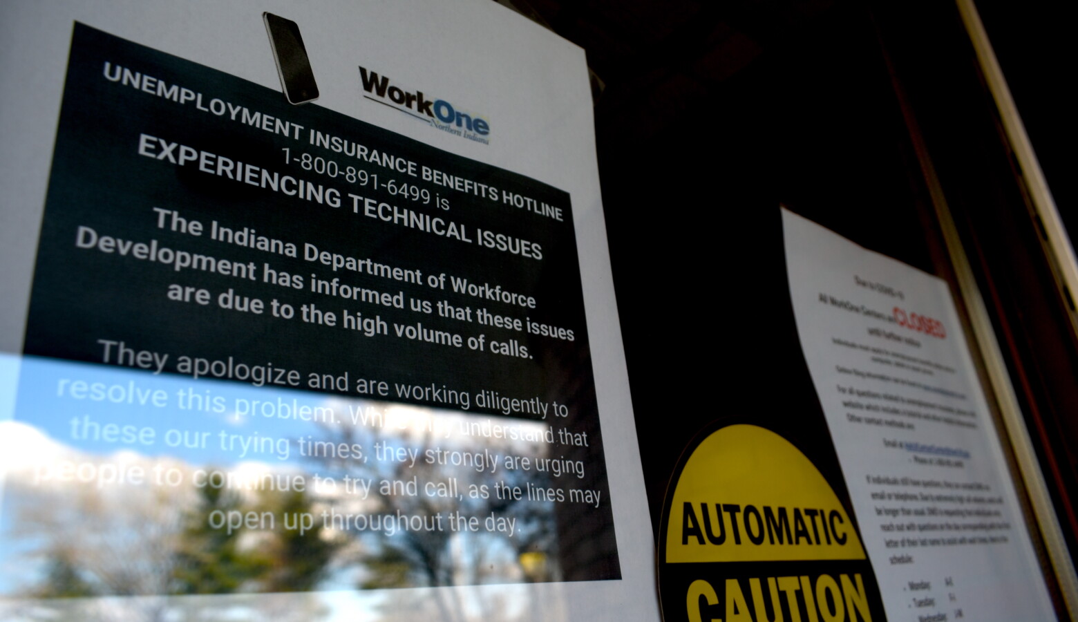 A sign informs visitors that while WorkOne employment offices are closed, the Department of Workforce Development is experiencing technical issues due to high call volumes. (Justin Hicks/IPB News)