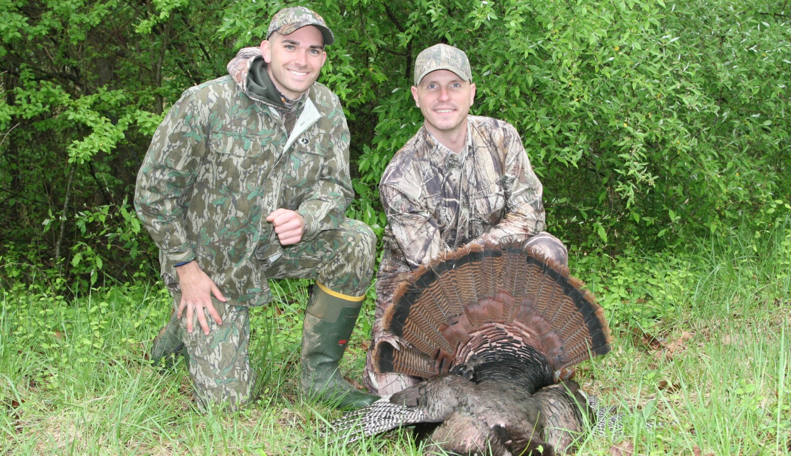 Kyle Allen, a Virginia state law enforcement officer, and Capt. Jacob Johnson, Marine Corps Systems Command, pose with a 20-pound turkey Johnson shot during a hunt at a Virginia Marine Corps base in 2016. (Adele Uphaus-Conner/U.S. Marine Corps)