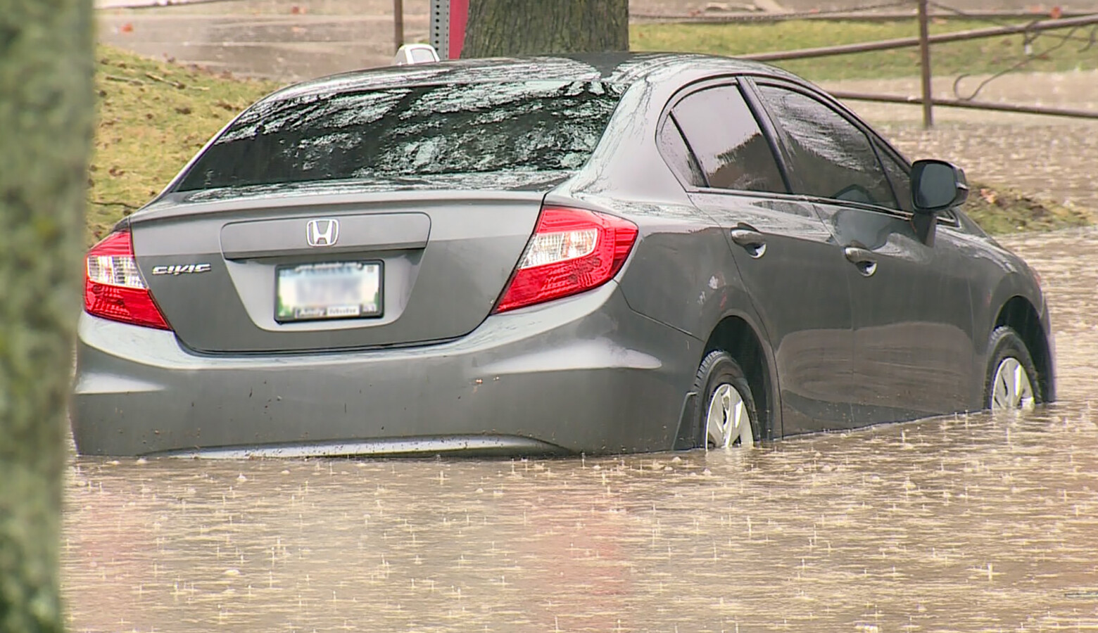 A parked car in high flood waters in Bloomington on Feb. 17, 2019. (FILE PHOTO: Steve Burns/WTIU)