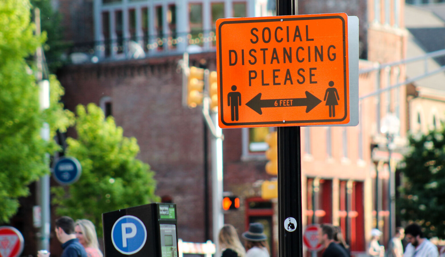 Downtown Indianapolis blocked parts of Mass Ave. to allow outdoor seating. The city also installed signs, reminding people to social distance while visiting businesses and restaurants. (Lauren Chapman/IPB News)