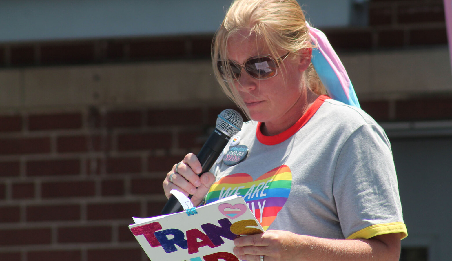 Katie, who didn’t provide her last name to protect the identity of her daughter, spoke at the demonstration. Her daughter, who is now a freshman, is not allowed to attend schools run by the Archdiocese. (Lauren Chapman/IPB News)