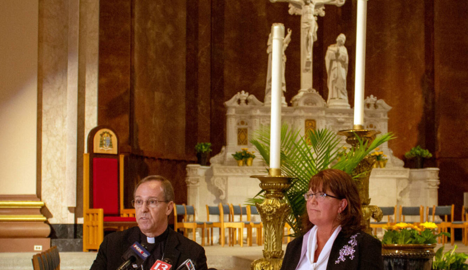 Archbishop Charles Thompson and Superintendent of Catholic Schools Gina Fleming defend the Archdiocese's policy on LGBTQ teachers at Catholics schools last year. (Evan Robbins/WFYI News)