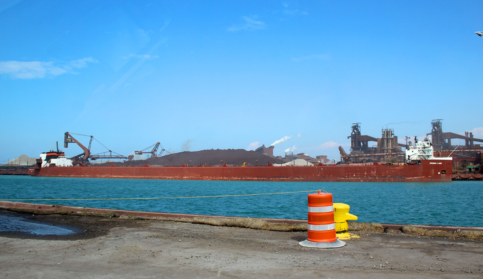 A semi-automated “laker” ship, the Stewart Cort, offloads iron ore at the steel-maker ArcelorMittal across from the Port of Indiana-Burns Harbor. (FILE PHOTO: Annie Ropeik/IPB News)