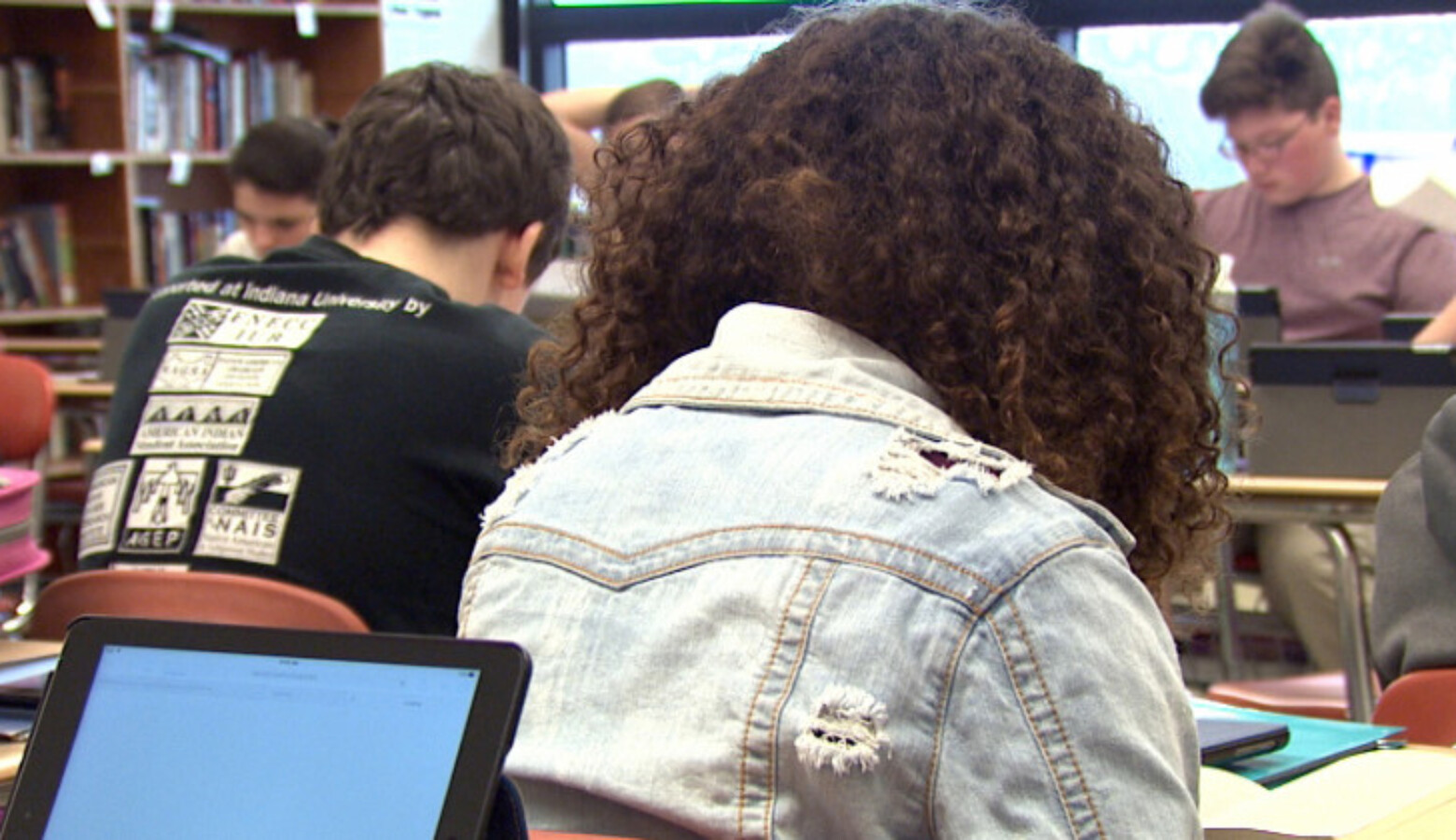 Middle school students in a classroom.