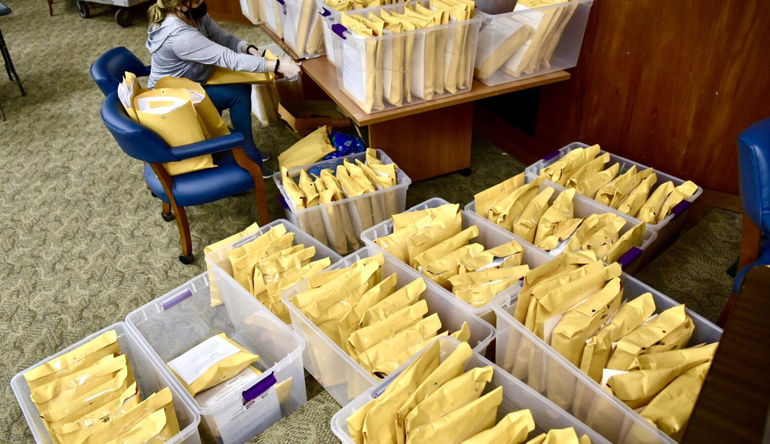 An election worker in St. Joseph County packages and stores ballot envelopes as part of the ballot counting process. (Justin Hicks/IPB News)