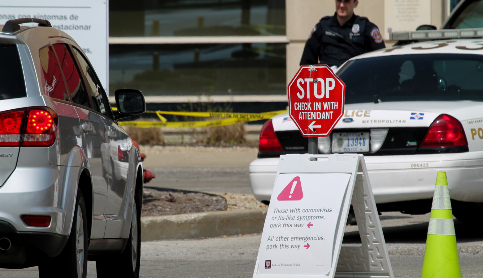 In front of Indiana University Health's Methodist Hospital, signs direct emergency room patients if they are experiencing COVID-19 symptoms. (Lauren Chapman/IPB News)