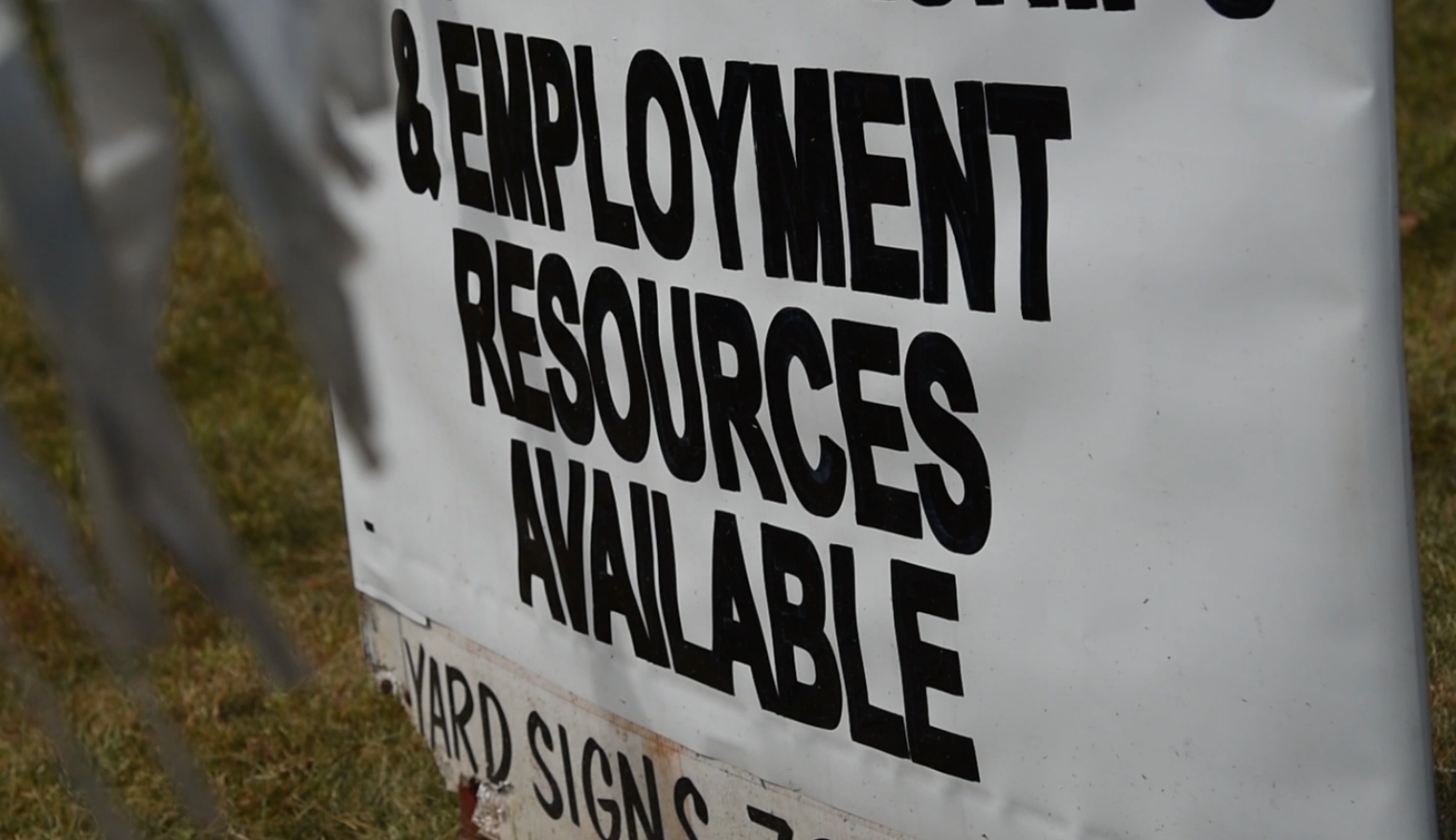 A sign outside Nu Corinthian Baptist Church in Indianapolis advertises employment resources at a weekly food handout during the pandemic. (Justin Hicks / IPB News)