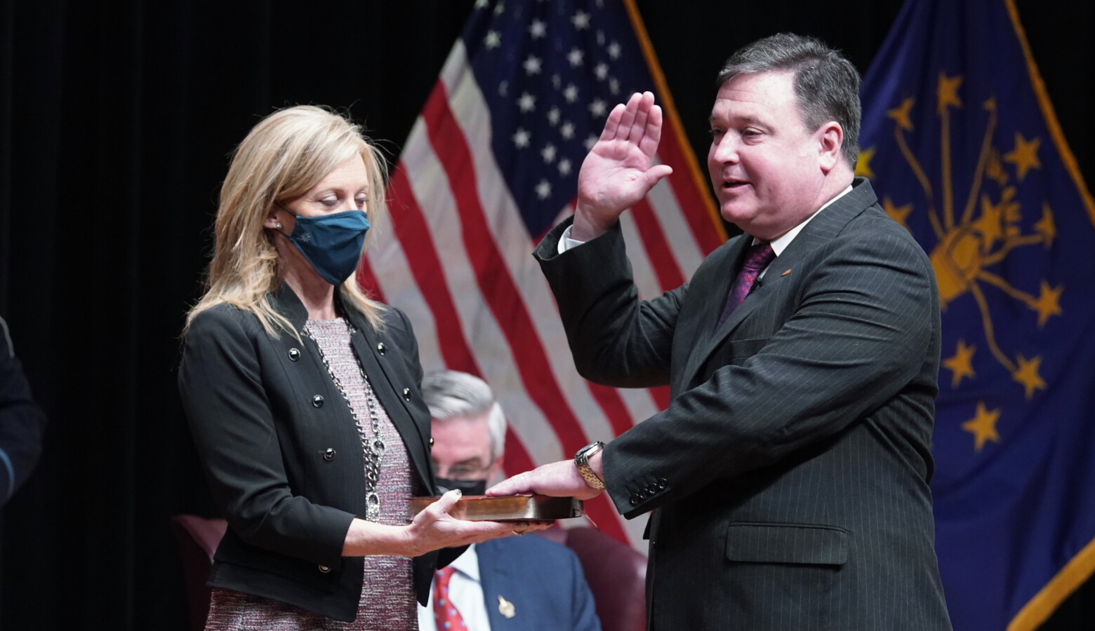 Todd Rokita, alongside his wife Kathy, is sworn in as Indiana's new Attorney General. (Associated Press)