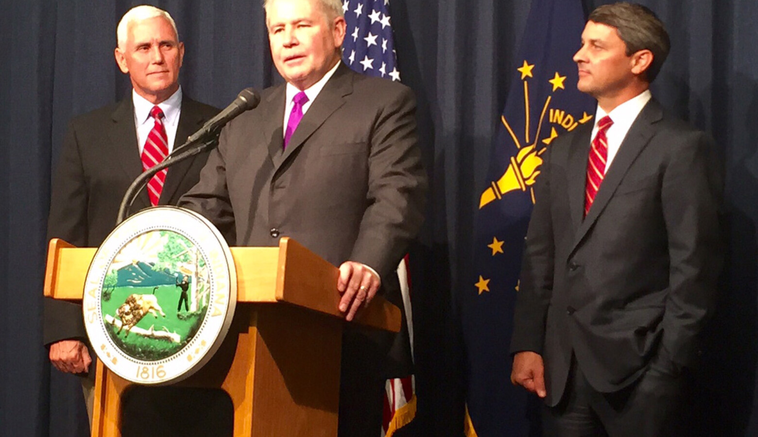 Jim Schellinger, center, was named the head of the Indiana Economic Development Corporation in 2015 by then-Gov. Mike Pence, left.
