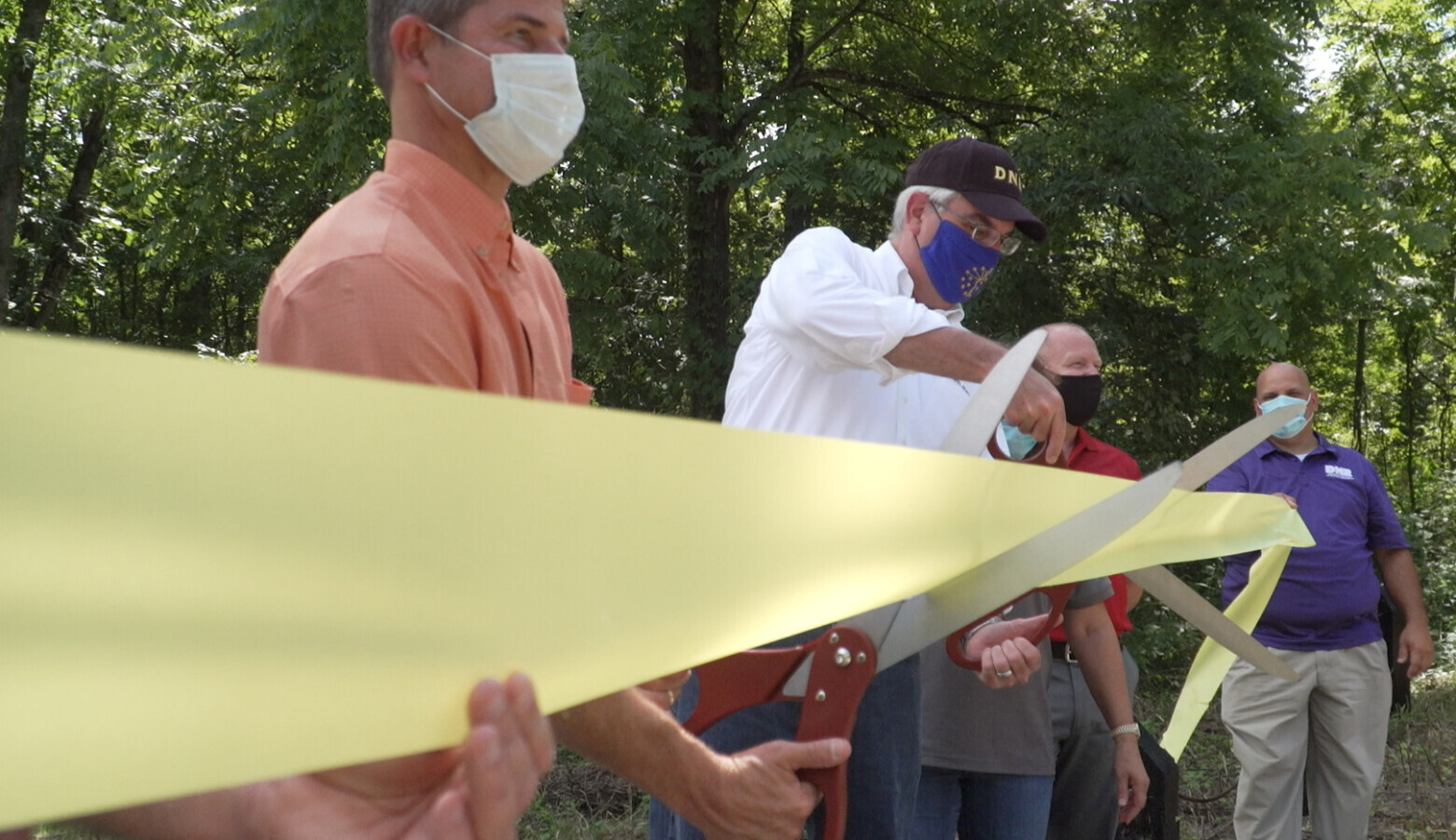 Gov. Eric Holcomb at a ribbon cutting for Ravinia State Forest last year. Tim Maloney with the Hoosier Environmental Council said the pandemic has shown the state needs more natural spaces for the public. (Alan Mbathi/IPB News)