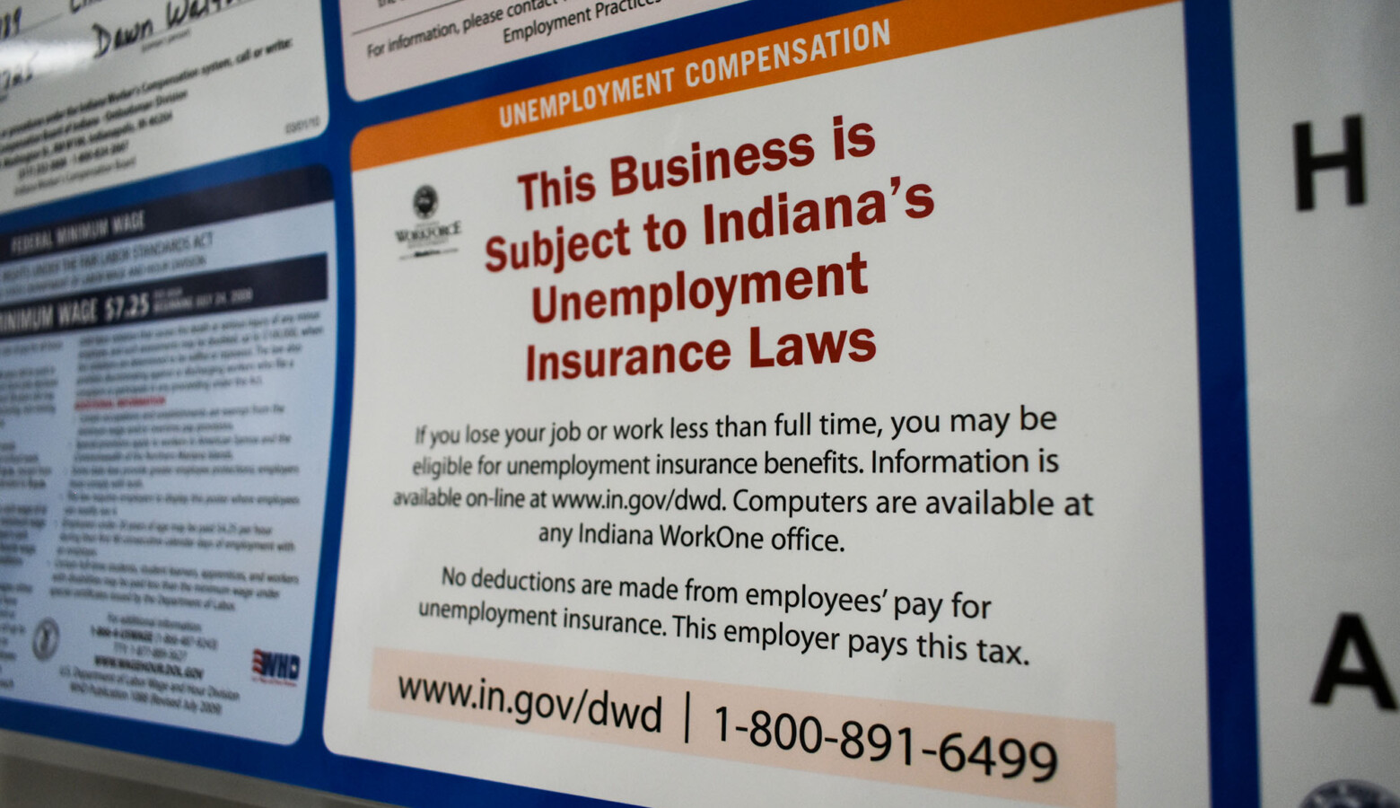 A public notice inside a human resources office stating it is subject to Indiana's unemployment insurance laws. (Justin Hicks/IPB News)
