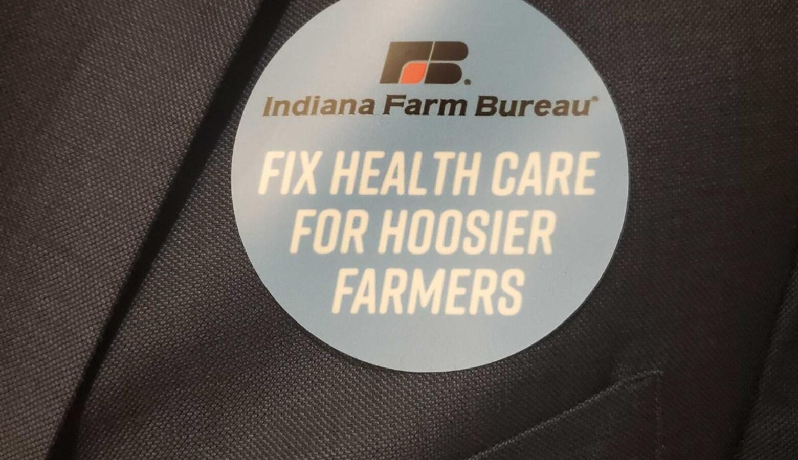 Indiana Farm Bureau members wore stickers during the 2020 Indiana legislative session to show support for a bill that would allow the organization to offer health benefit plan. (Samantha Horton/IPB News)