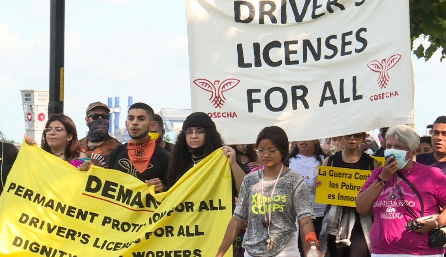 Members of Movimiento Cosecha Indiana march along the White River in Indianapolis, demanding driver's licenses for undocumented Hoosiers. (Lauren Chapman/IPB News)